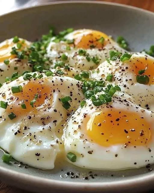 Poached Eggs with Fresh Herbs and Black Pepper: A Simple and Elegant Breakfast