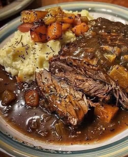 Beef and Gravy Served on Creamy Mashed Potatoes