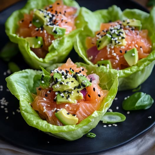 Salmon Tartare Lettuce Cups with Avocado Cream and Sesame Seeds